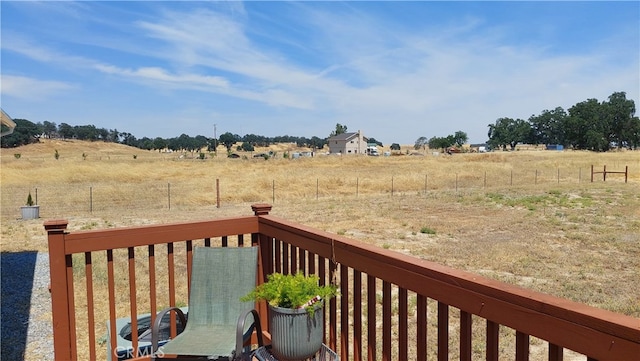 wooden deck with cooling unit and a rural view