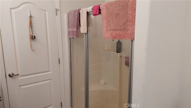 bathroom featuring an enclosed shower