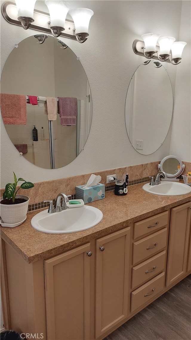 bathroom featuring vanity and wood-type flooring