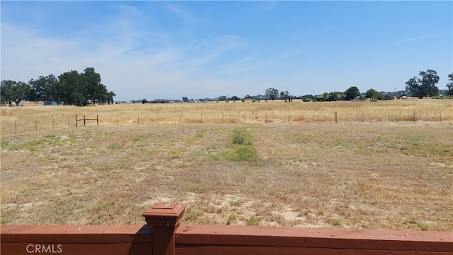 view of yard with a rural view