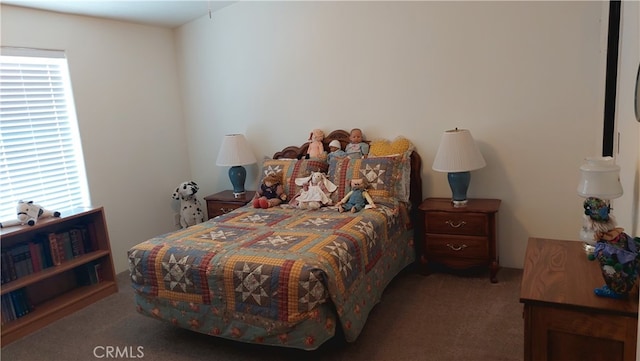 carpeted bedroom featuring multiple windows