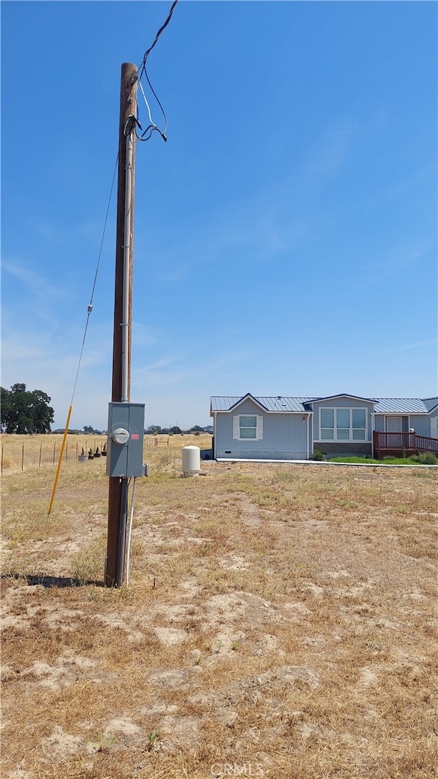 view of yard with a rural view