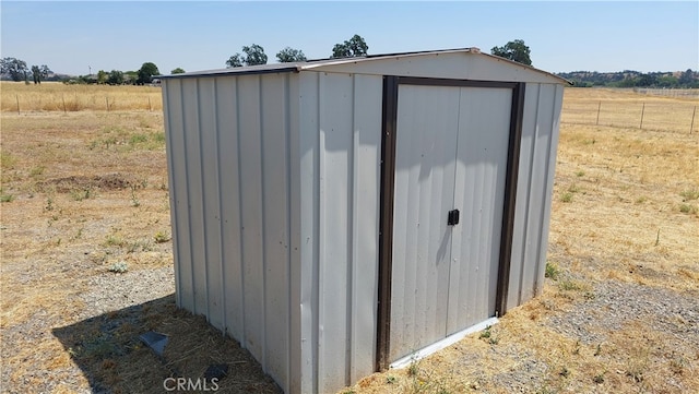 view of outbuilding featuring a rural view