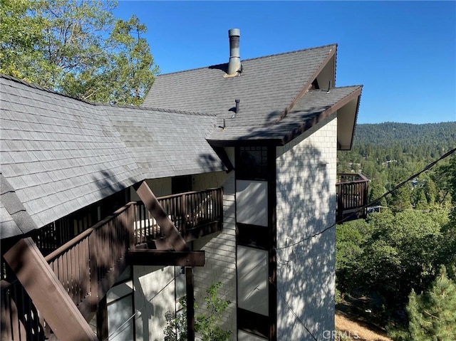 rear view of property featuring a balcony