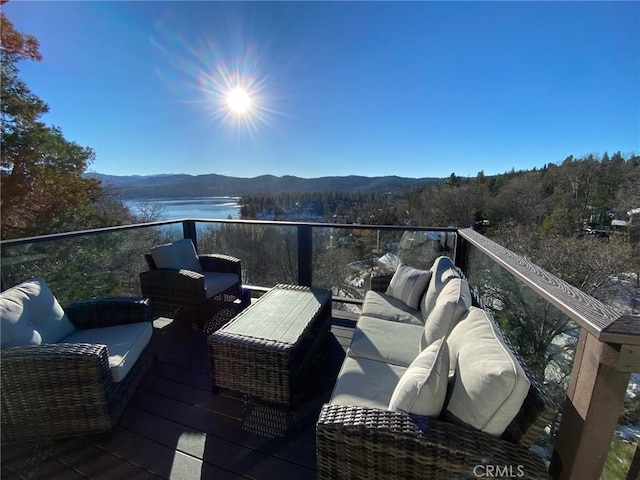 balcony with a water and mountain view