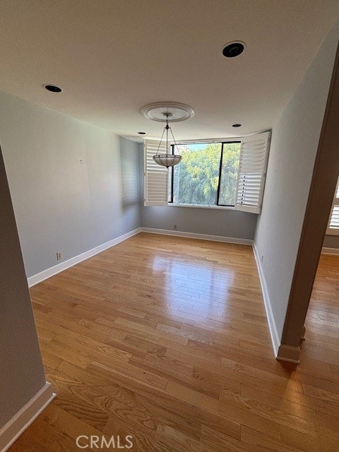 spare room featuring hardwood / wood-style floors