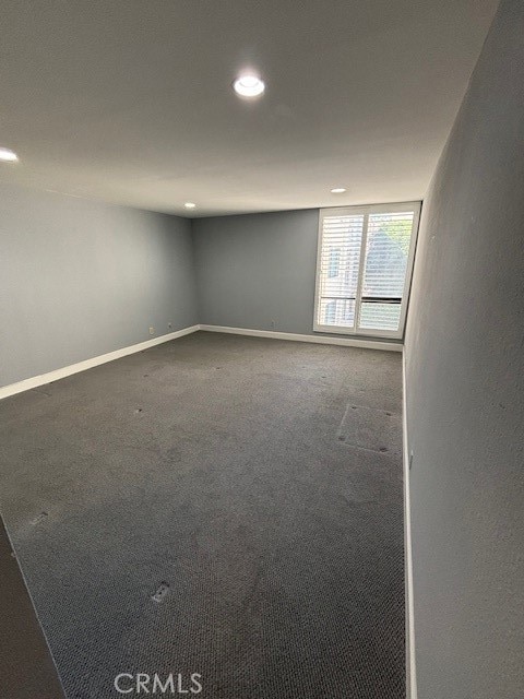 empty room featuring carpet flooring