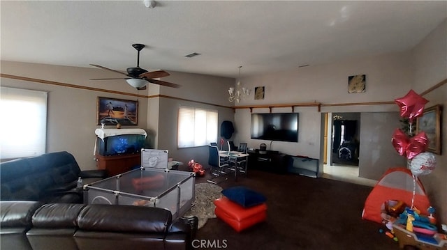 living room with ceiling fan and vaulted ceiling