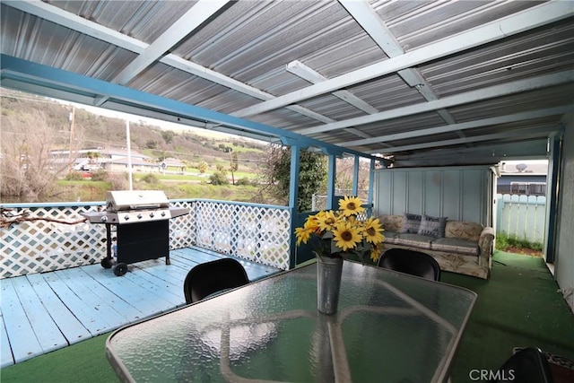 wooden deck featuring area for grilling and an outdoor hangout area