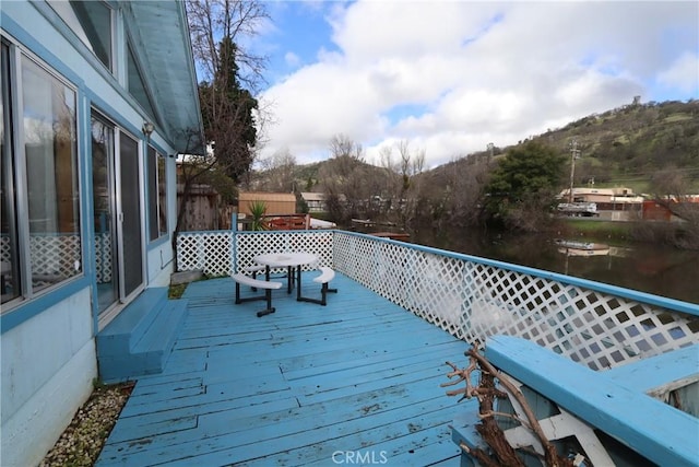 wooden deck featuring a mountain view