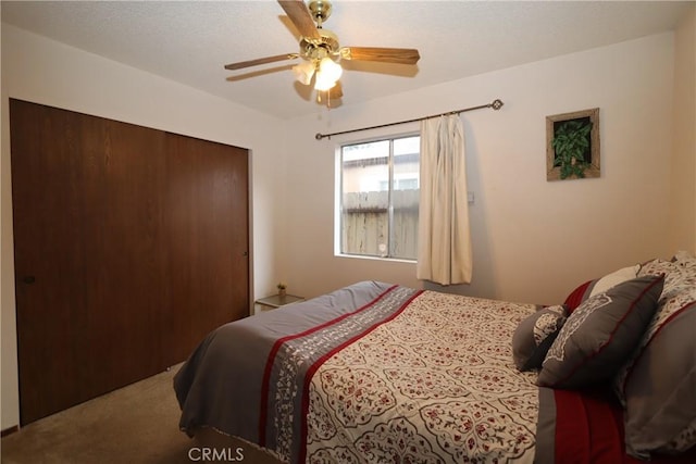 carpeted bedroom with ceiling fan