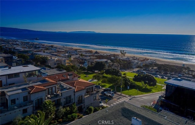 bird's eye view featuring a water view and a view of the beach