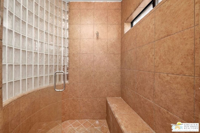 bathroom with a shower with shower door