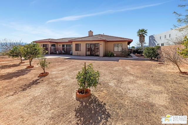 rear view of property with a patio area