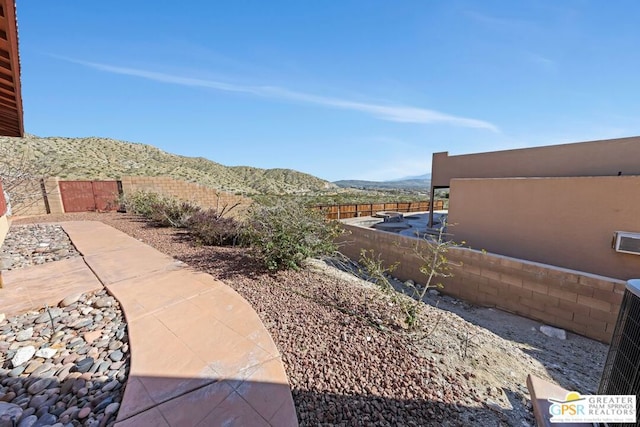 view of yard with a mountain view and a patio