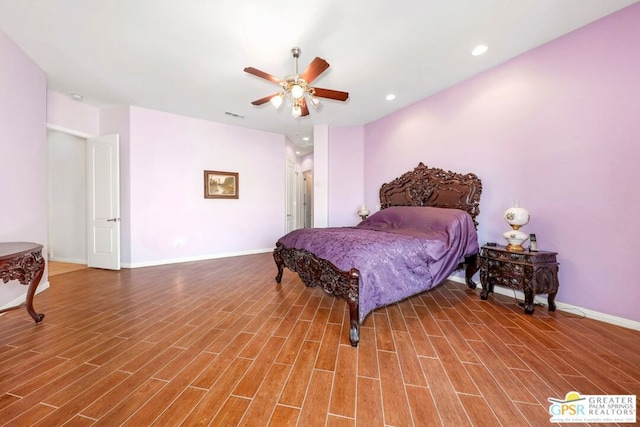 bedroom with ceiling fan and hardwood / wood-style floors