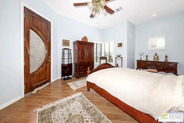 bedroom featuring light hardwood / wood-style floors, multiple windows, and ceiling fan