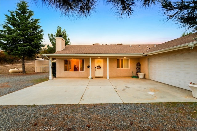 ranch-style house featuring a garage