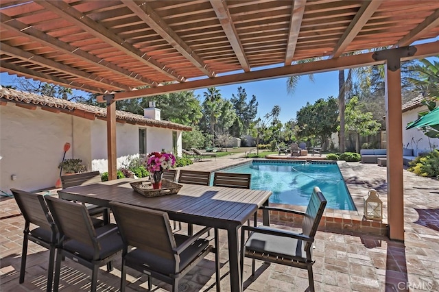 view of swimming pool with a patio area and a pergola