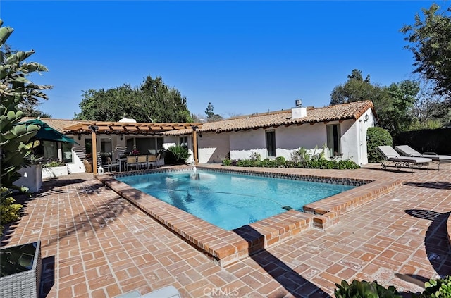 view of swimming pool with a pergola and a patio