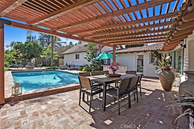 view of patio / terrace with a fenced in pool and a pergola