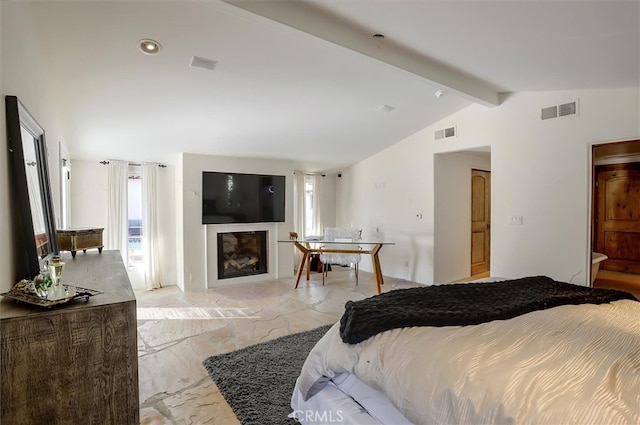 bedroom with lofted ceiling with beams