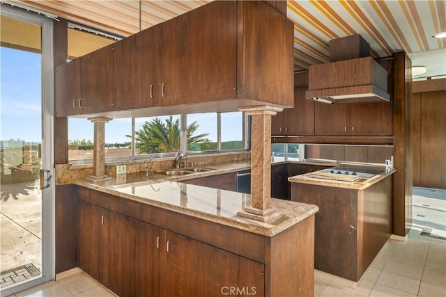 1470 Laurel Way, Beverly Hills, CA 90210 - kitchen with a sink, light stone counters, light tile patterned floors, and a peninsula