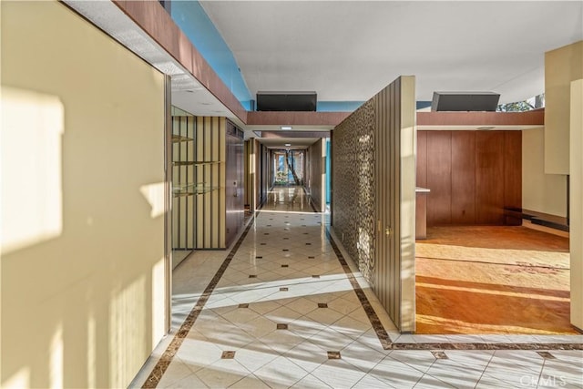 hallway featuring light tile patterned flooring