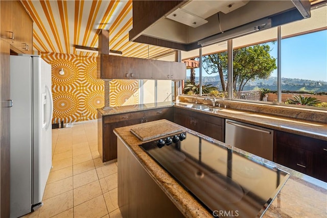 1470 Laurel Way, Beverly Hills, CA 90210 - kitchen with white refrigerator with ice dispenser, dishwasher, black electric stovetop, wallpapered walls, and light tile patterned flooring