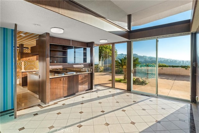 1470 Laurel Way, Beverly Hills, CA 90210 - kitchen with light tile patterned floors and a mountain view