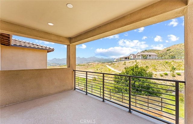 balcony featuring a mountain view