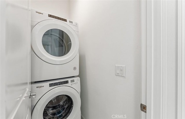 washroom with stacked washer and clothes dryer