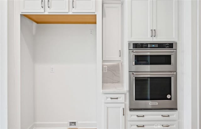 kitchen with white cabinets and stainless steel double oven