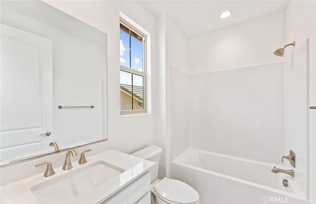 full bathroom with vanity, toilet, and washtub / shower combination