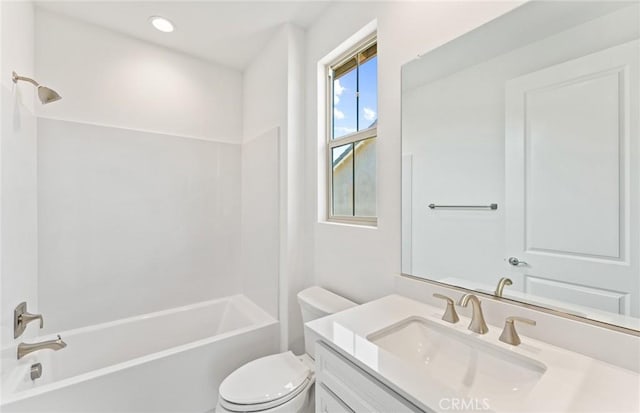 full bathroom with bathtub / shower combination, vanity, and toilet