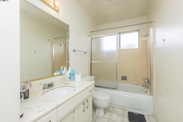 full bathroom with vanity, enclosed tub / shower combo, and toilet