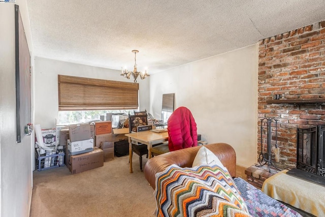 living room with light carpet, a textured ceiling, a chandelier, and a brick fireplace