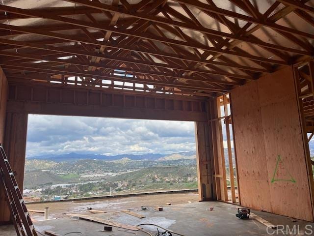 garage featuring a mountain view and vaulted ceiling