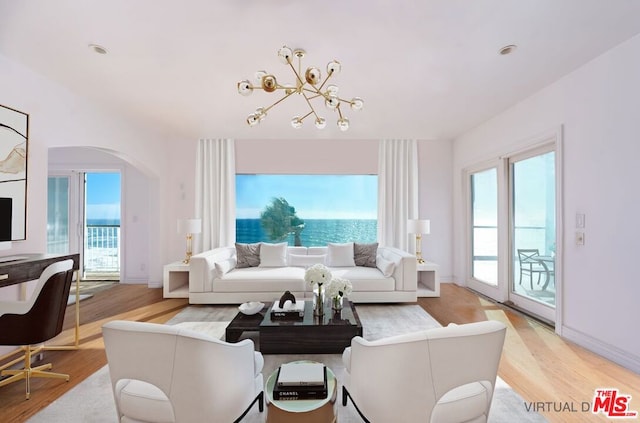 living room with an inviting chandelier and hardwood / wood-style floors