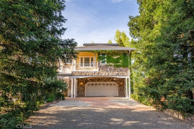 view of front of property with a garage and covered porch