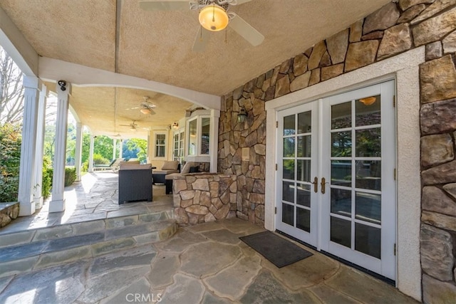 view of patio / terrace with outdoor lounge area, ceiling fan, and french doors