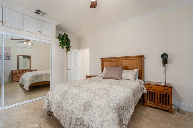 tiled bedroom featuring crown molding, ceiling fan, a wall unit AC, and a closet