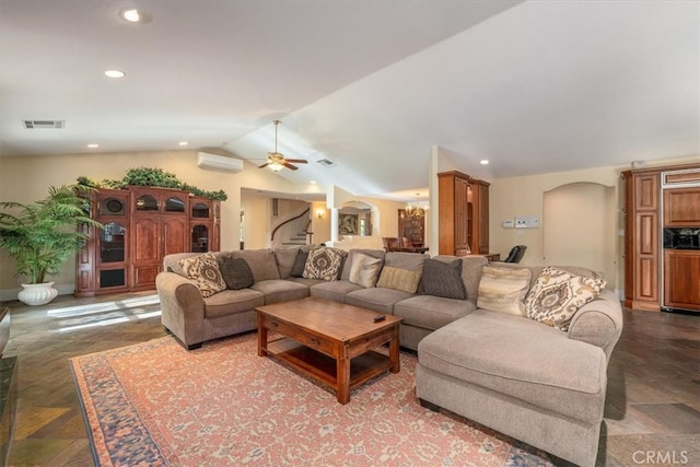 living room featuring vaulted ceiling, ceiling fan, and a wall unit AC