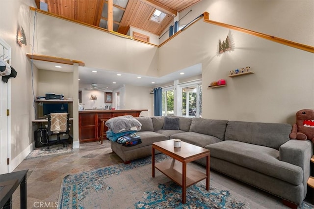 living room with a high ceiling and wood ceiling