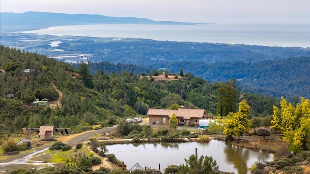 bird's eye view with a water and mountain view