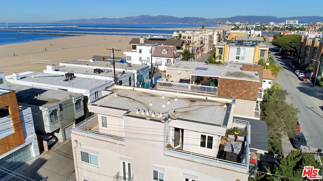 aerial view featuring a water and mountain view