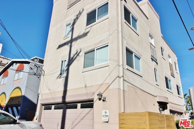 view of building exterior with a garage