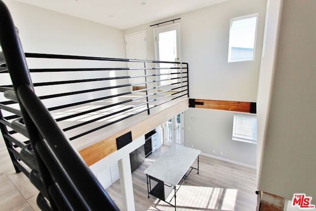 stairs featuring hardwood / wood-style floors