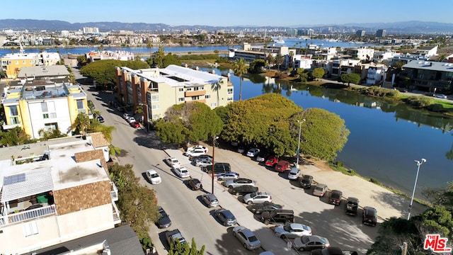 aerial view featuring a water and mountain view