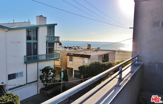 balcony featuring a water view